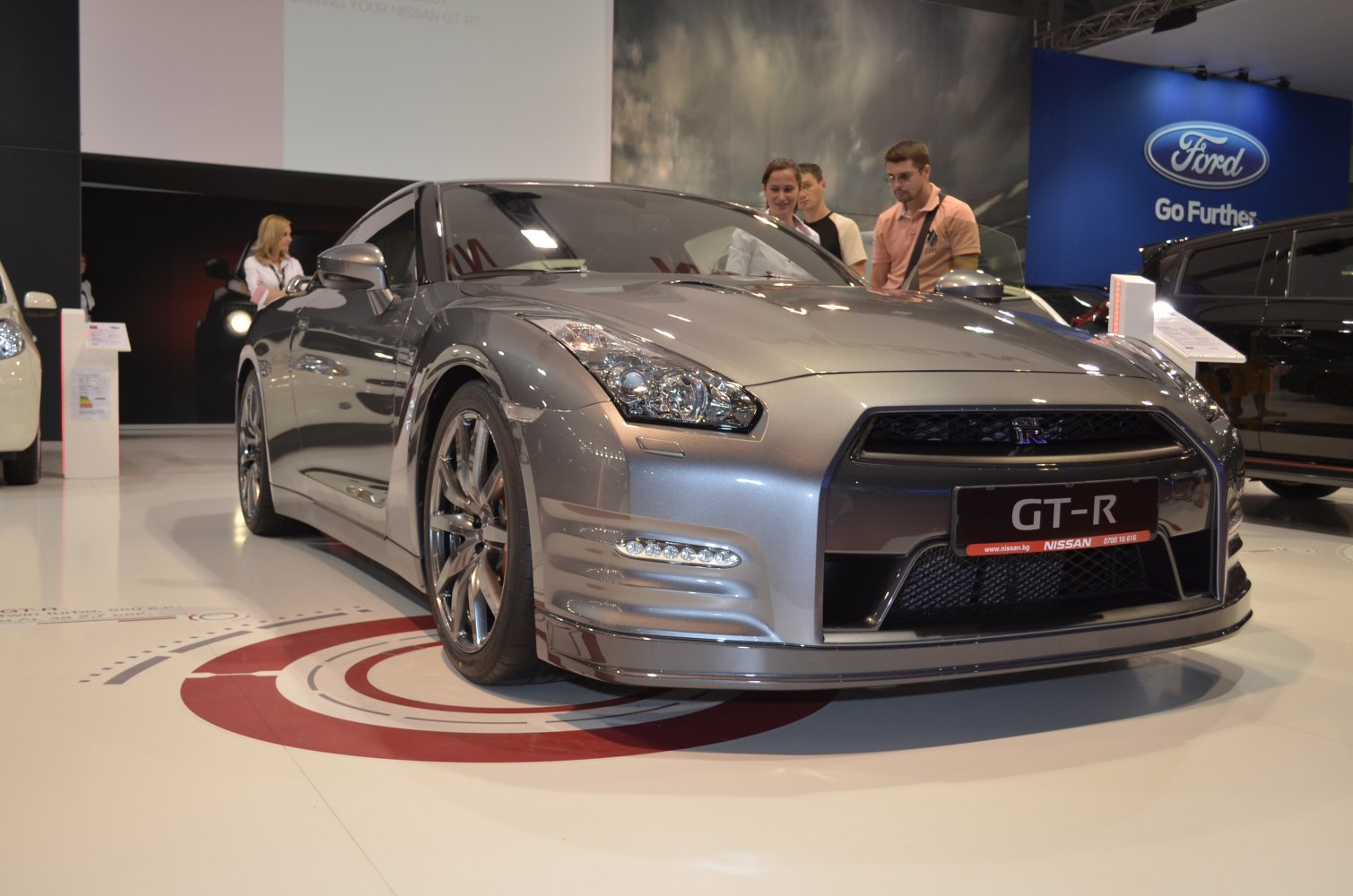 Front view with sleek headlamps and aggressive grille