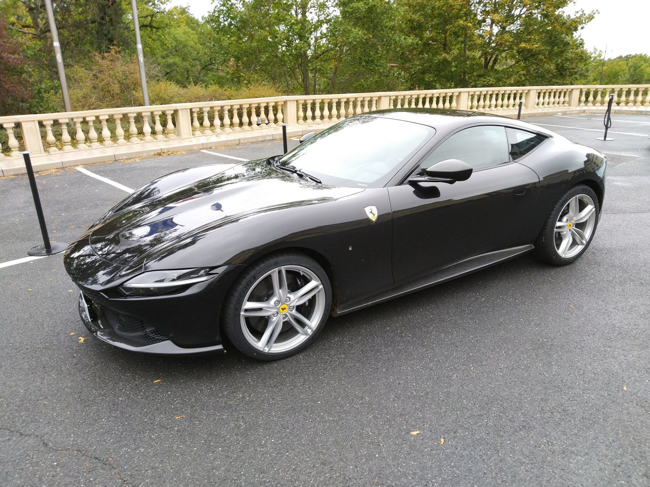 Sleek black coupe with silver five-spoke wheels