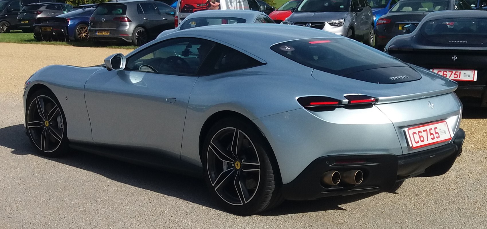 Sleek rear and side profile with dual exhaust and aerodynamic curves