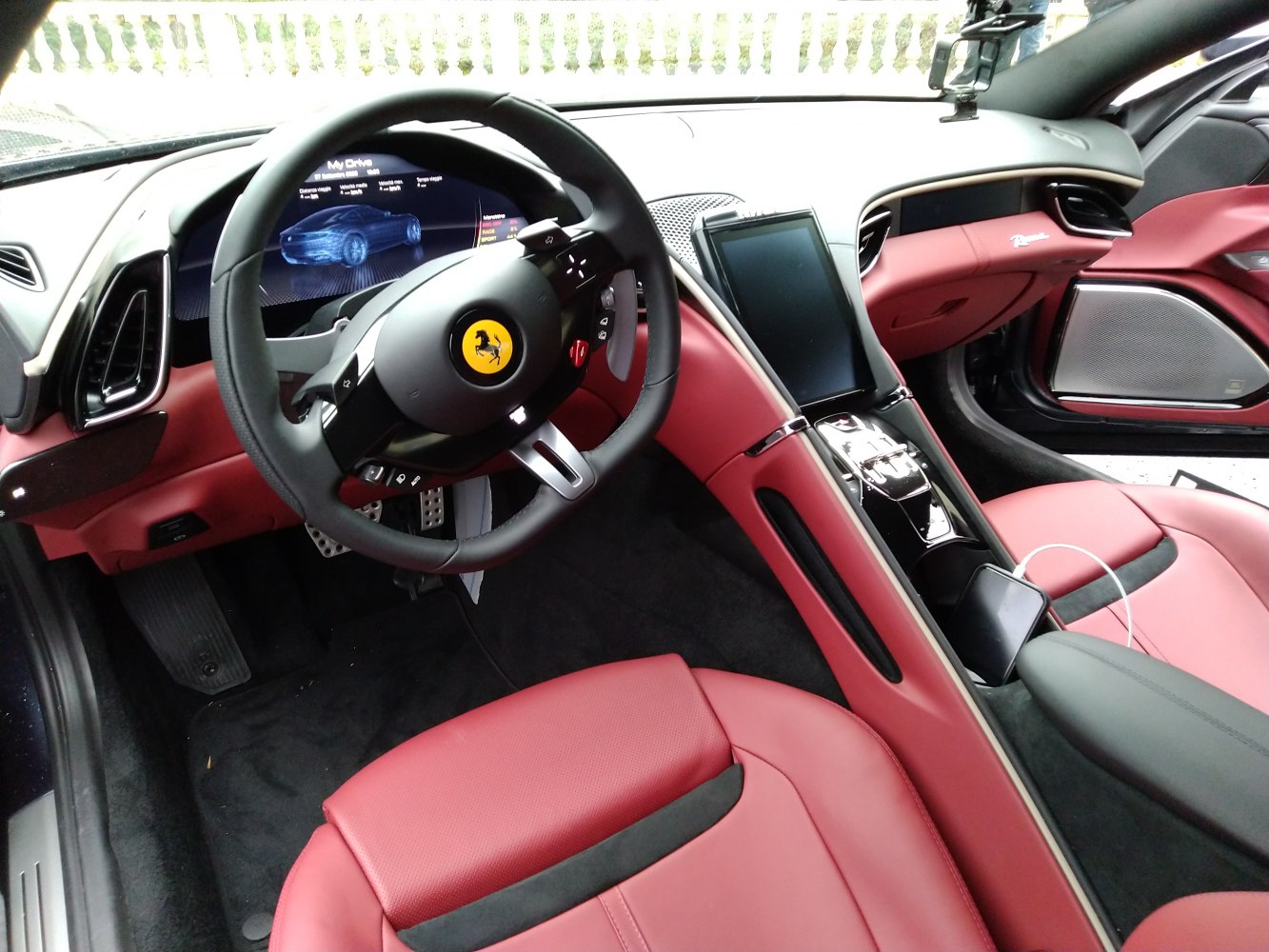 Digital dashboard and red leather interior with high-tech steering wheel