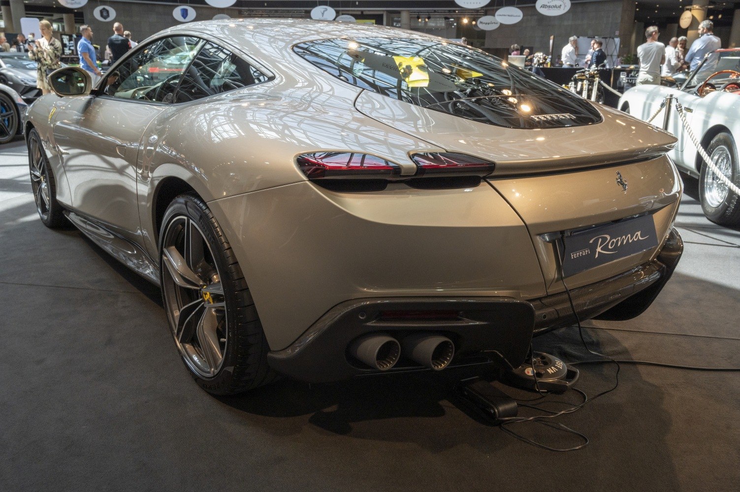 Sleek rear view with distinctive tail lights and dual exhaust pipes.