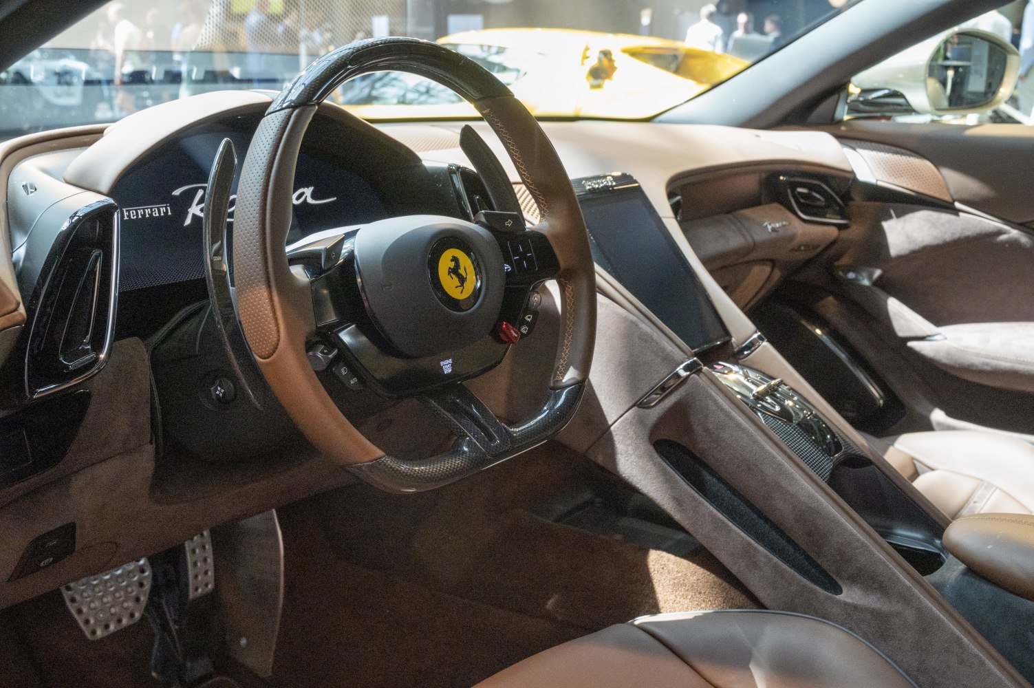 Luxury car interior with leather seats and carbon fiber steering wheel