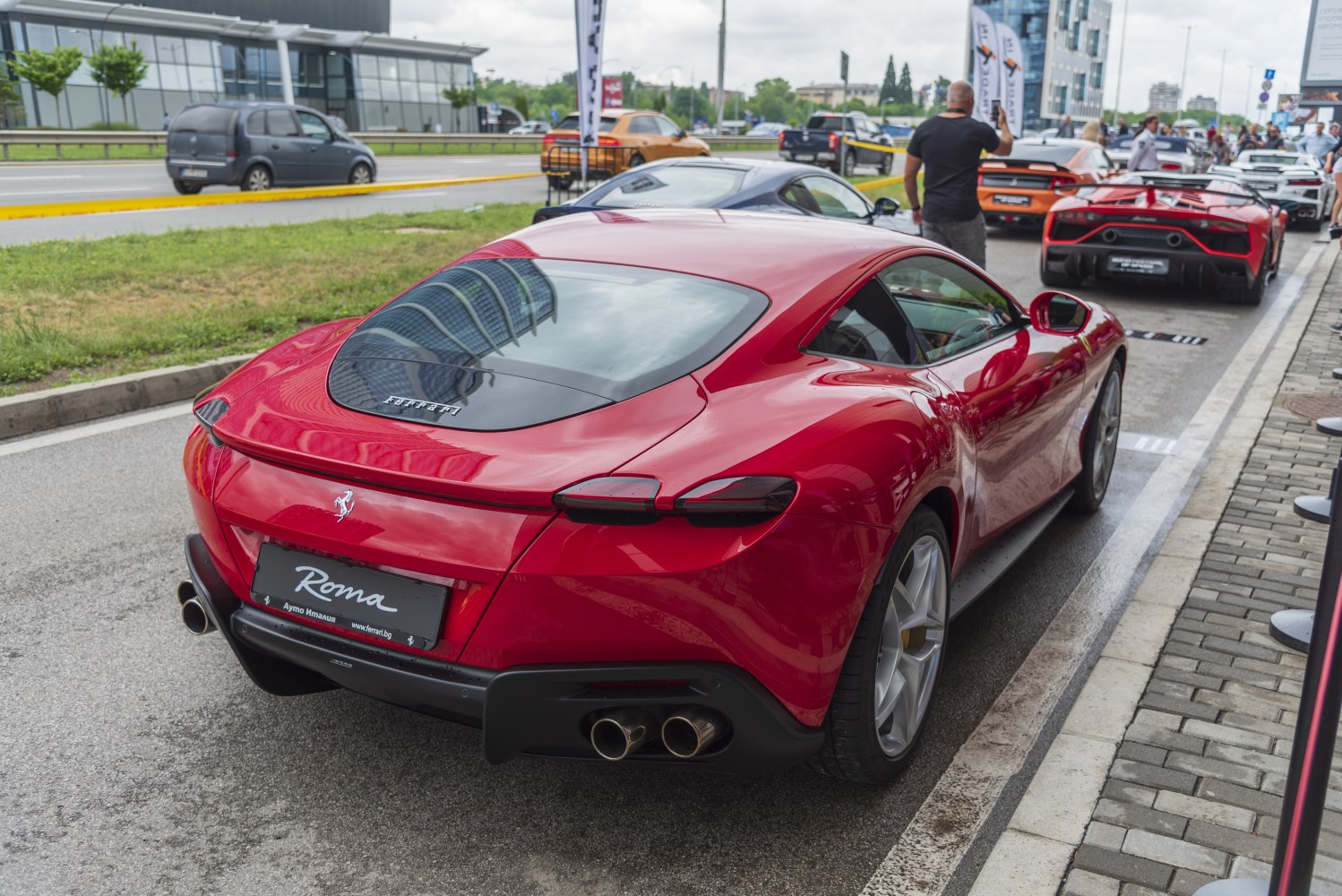 Rear view of red luxury coupe with quad exhaust and sleek tail lights