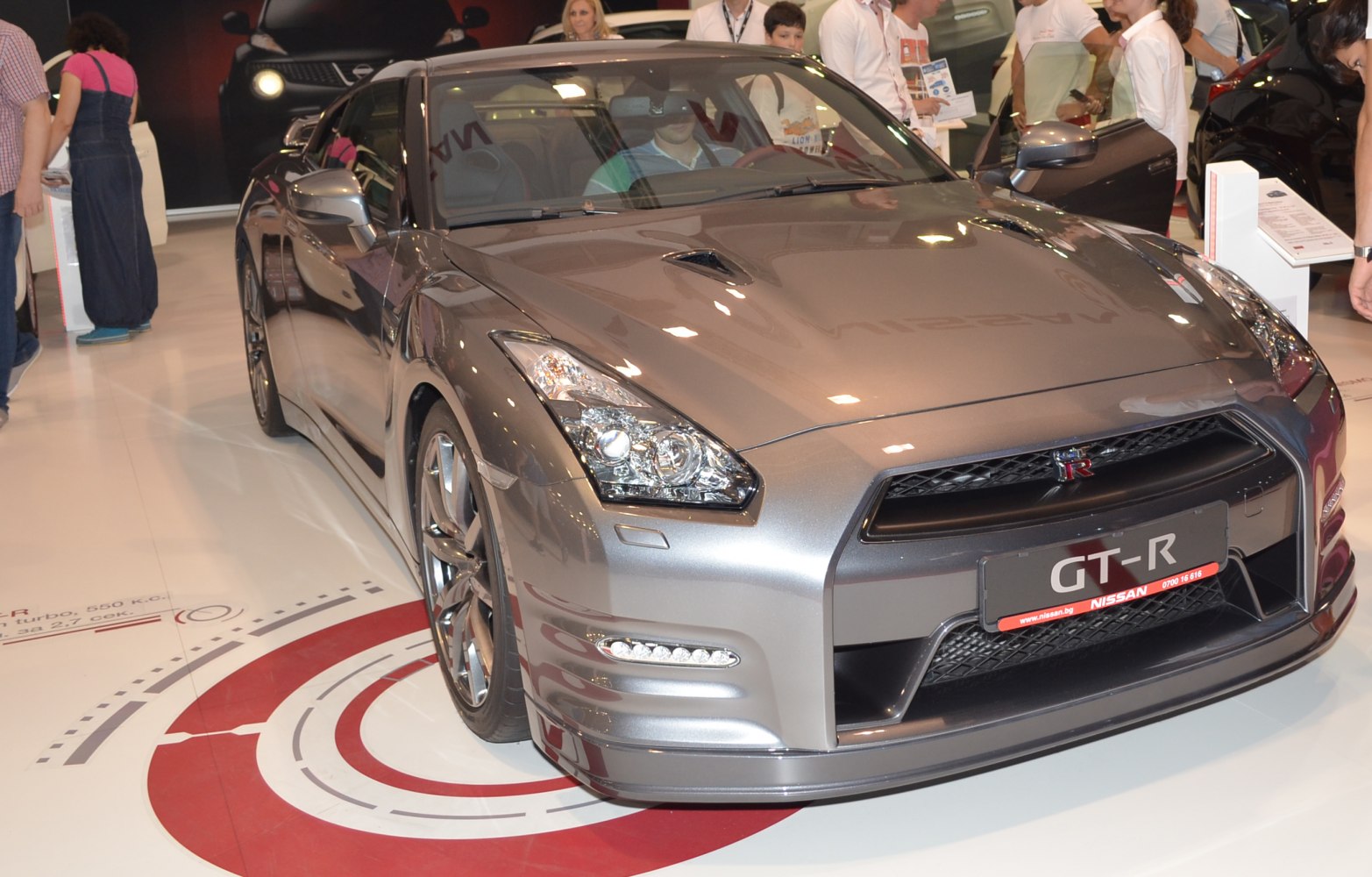 Front view of a sleek sports car with sharp headlights and aerodynamic design