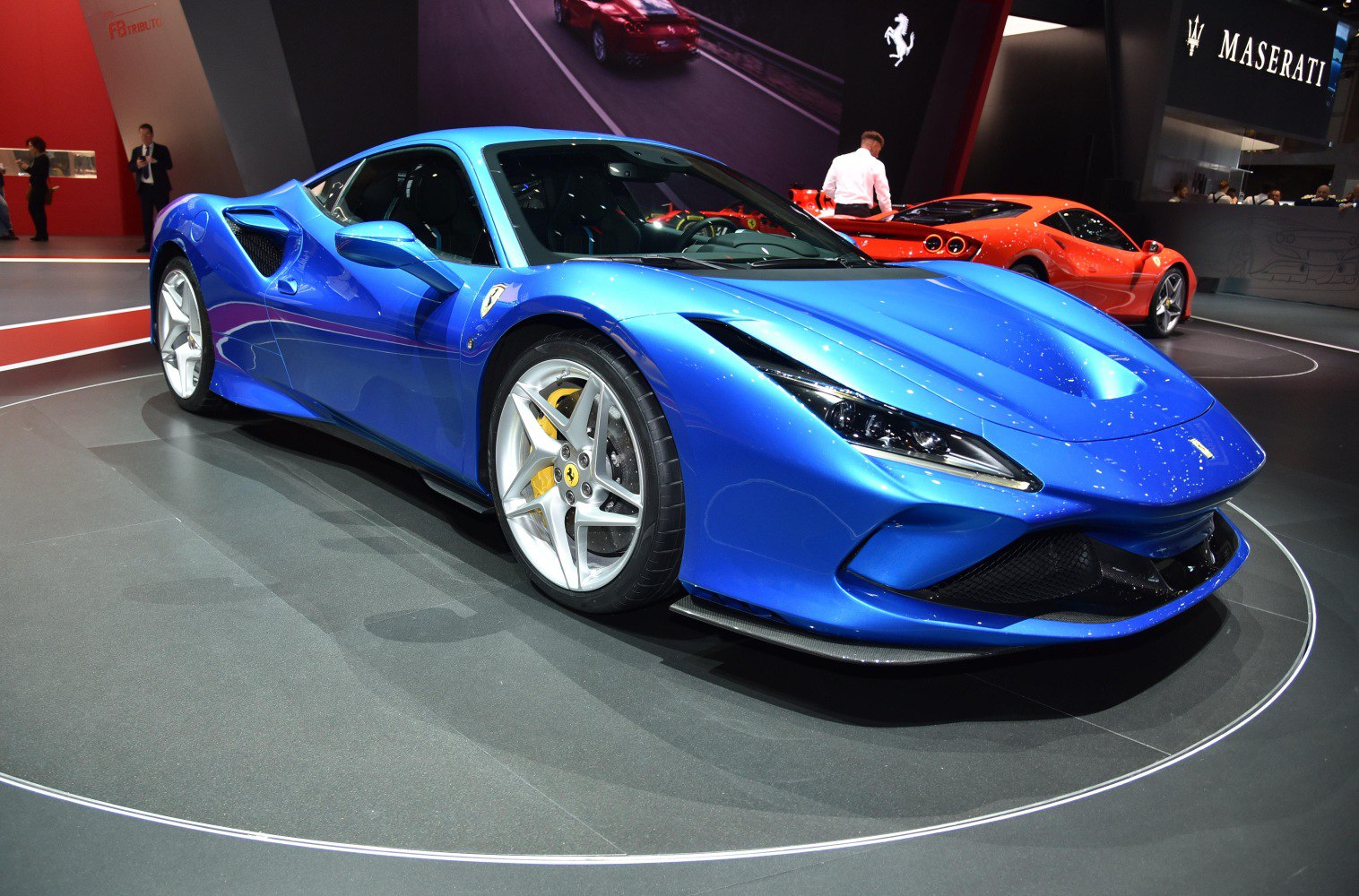 Blue sports car with aerodynamic body and LED headlights