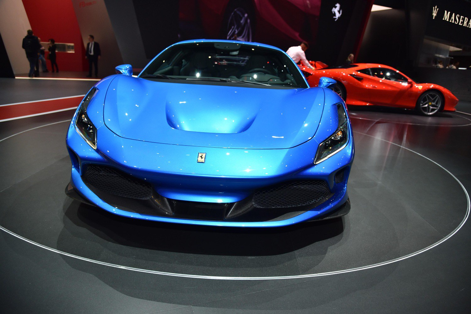 Front view of aerodynamic sports coupe with aggressive lights and large air intakes