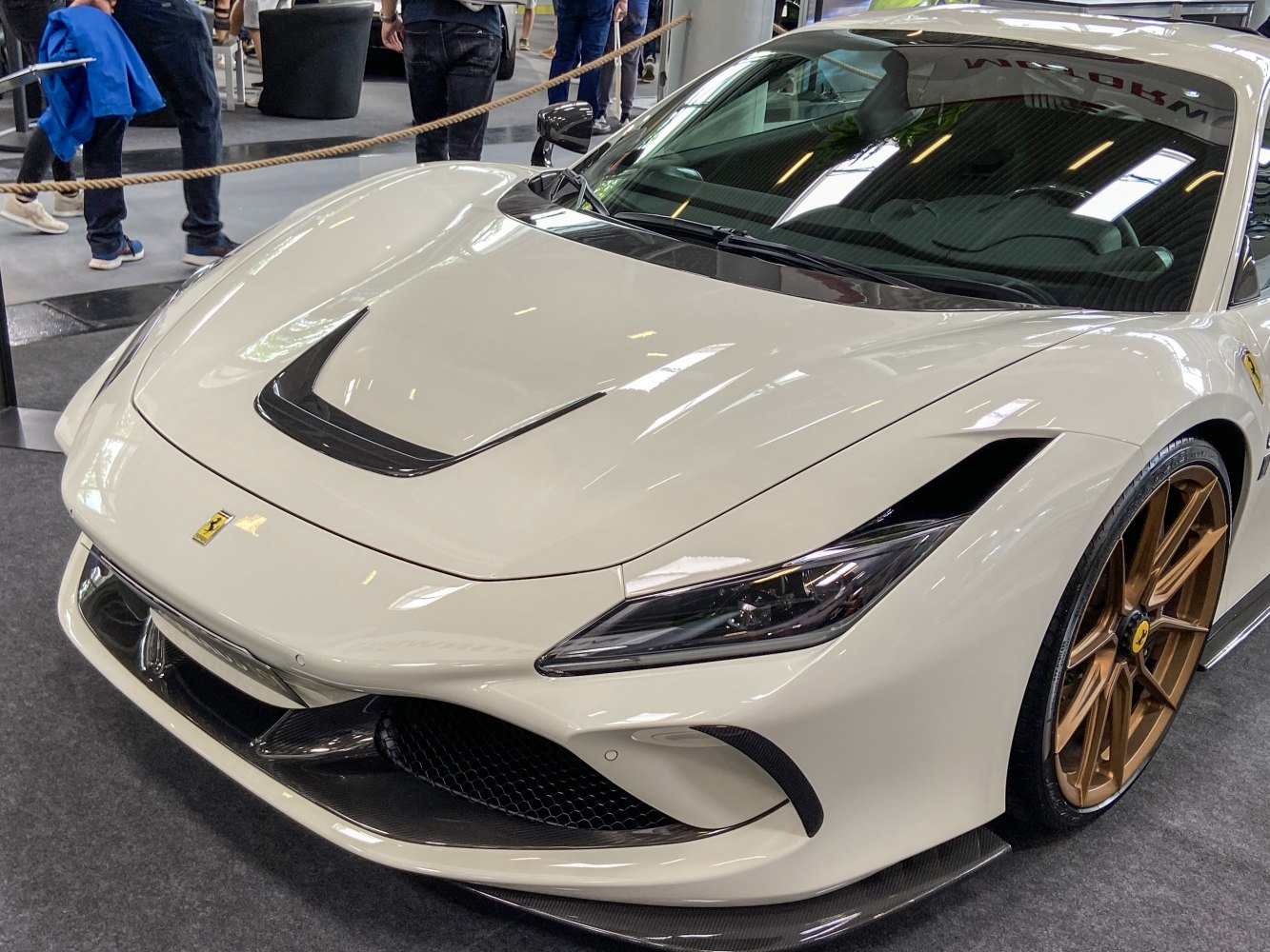 Front end with sleek headlights and bronze alloy wheels