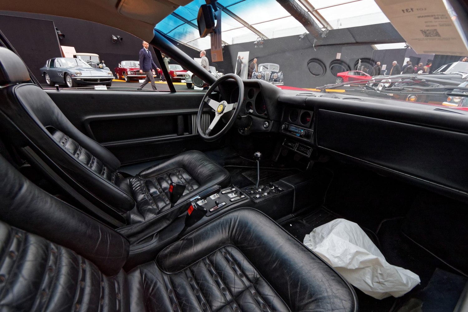 Black leather interior with classic steering wheel and manual gear shift