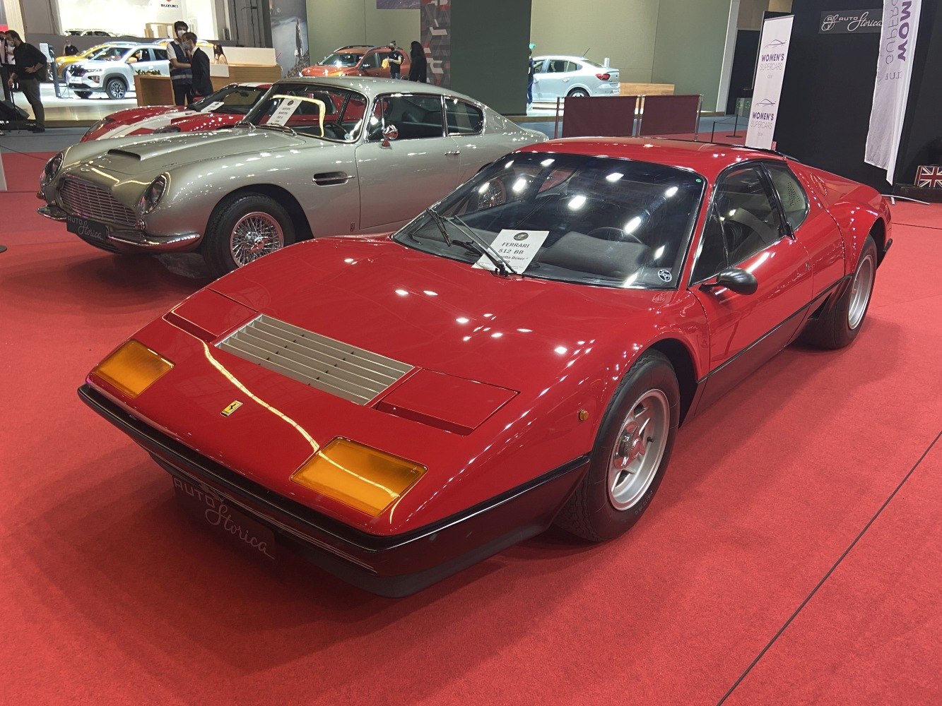 Red sports car with pop-up headlights and aerodynamic mid-engine design