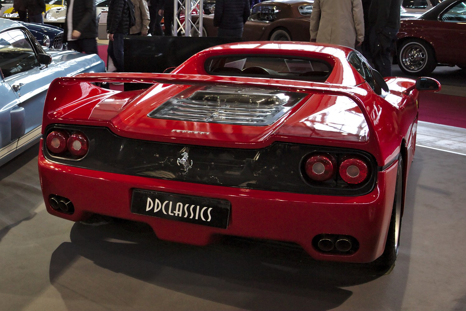 Rear wing, transparent engine cover, dual circular tail lights