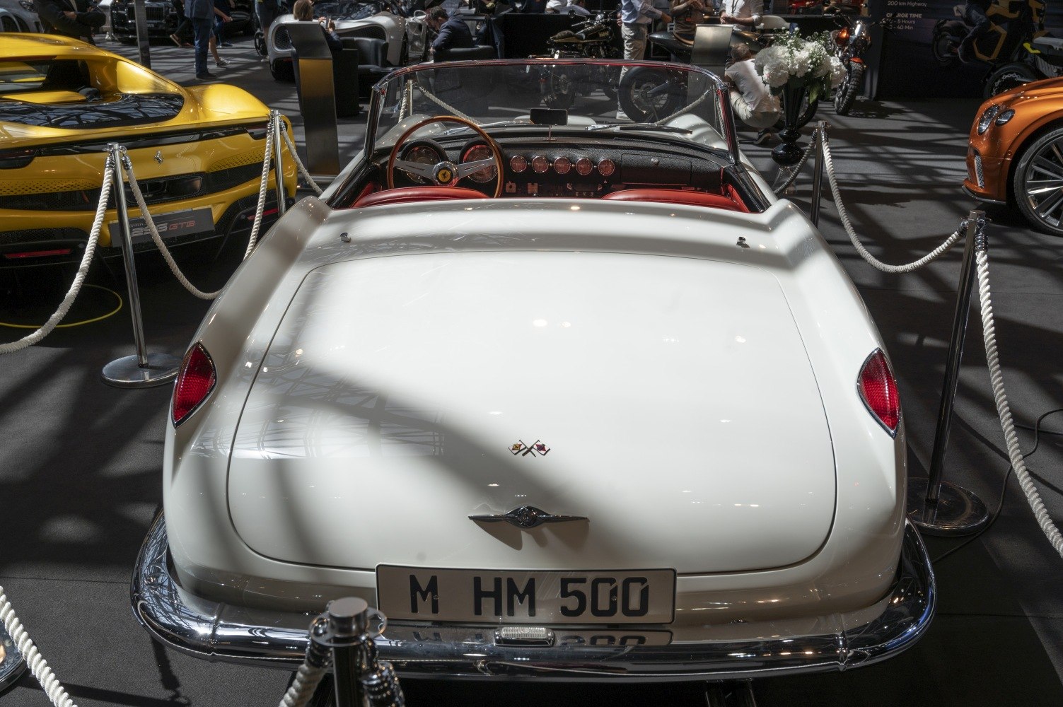 Convertible rear view and wooden steering wheel cockpit interior