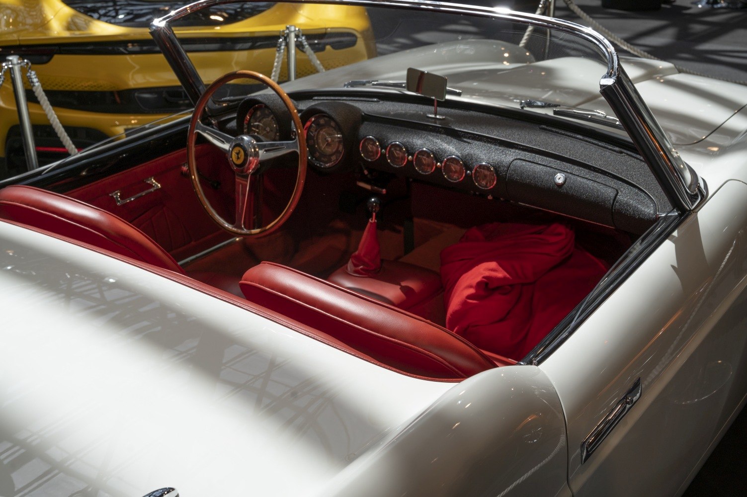 Red leather interior and vintage dashboard with multiple gauges