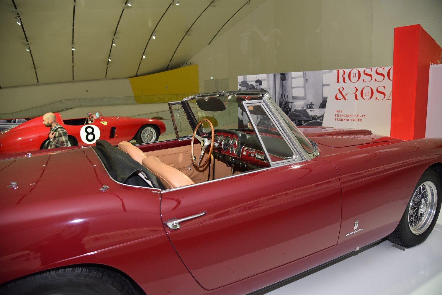 Classic 1957 convertible with wooden steering wheel and brown leather interior