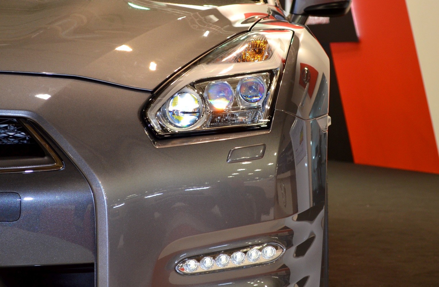 Close-up of GT-R R35 facelift headlight and LED daytime running light