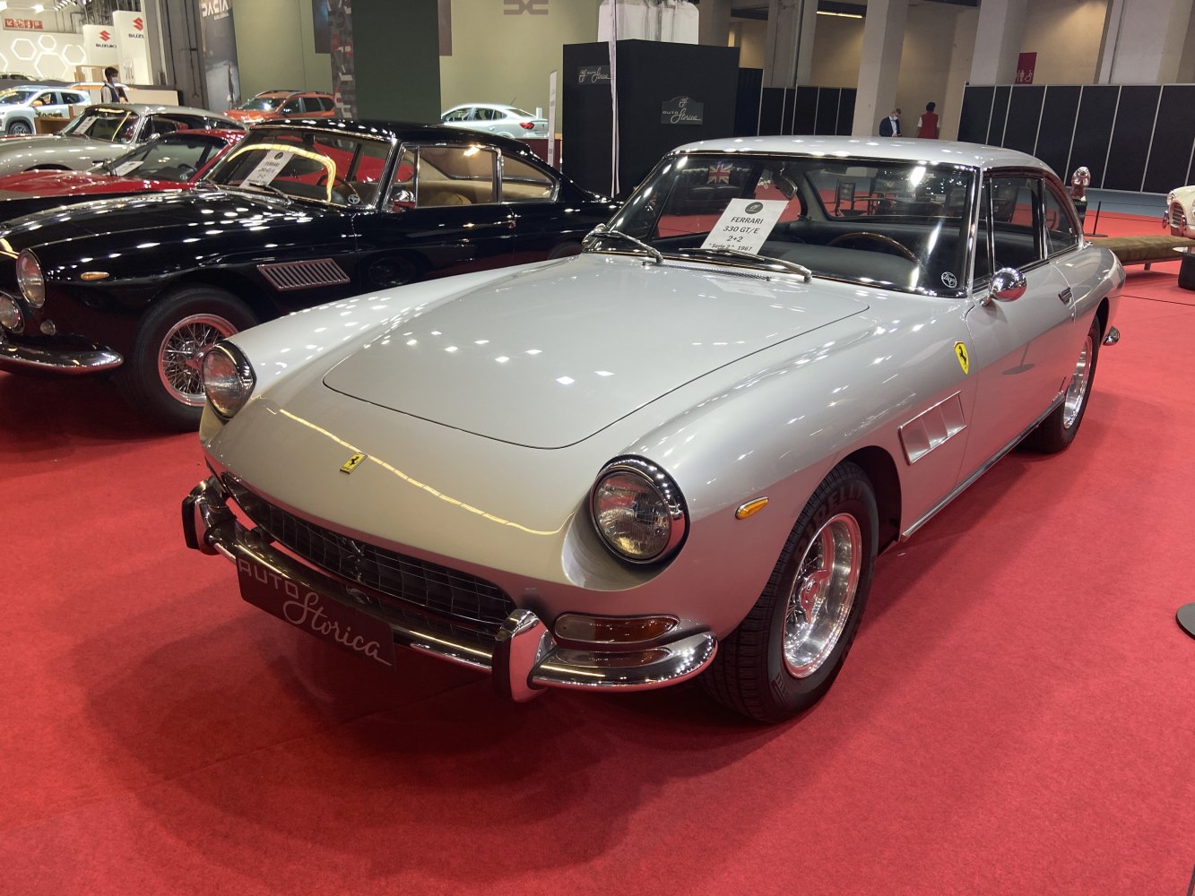 Classic car front and side view with chrome bumper and round headlights