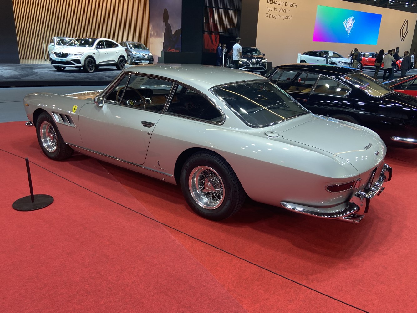 Vintage luxury coupe with wire-spoke wheels and sleek, streamlined body
