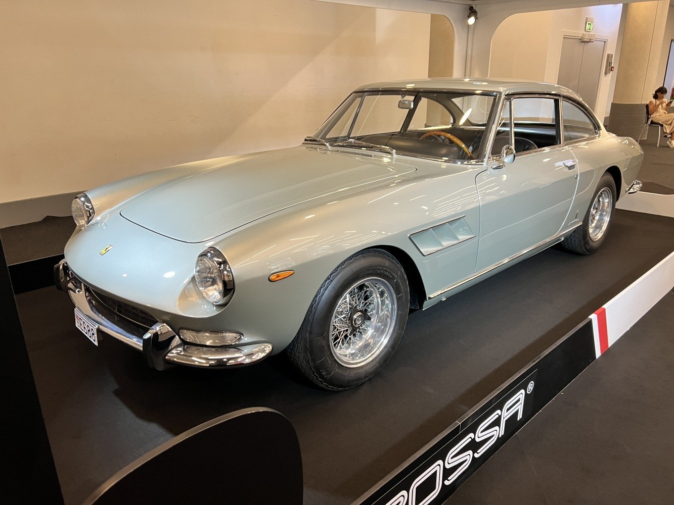 Sleek vintage coupe with wire wheels and round headlights