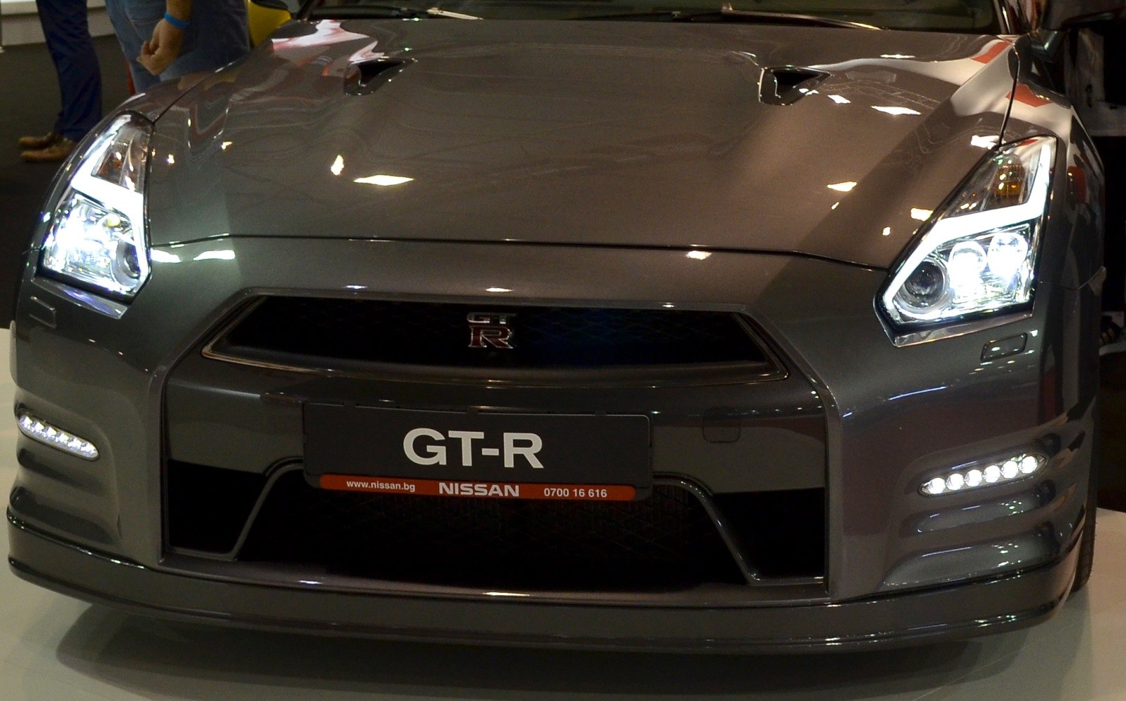 Front view with LED headlights and hood vents