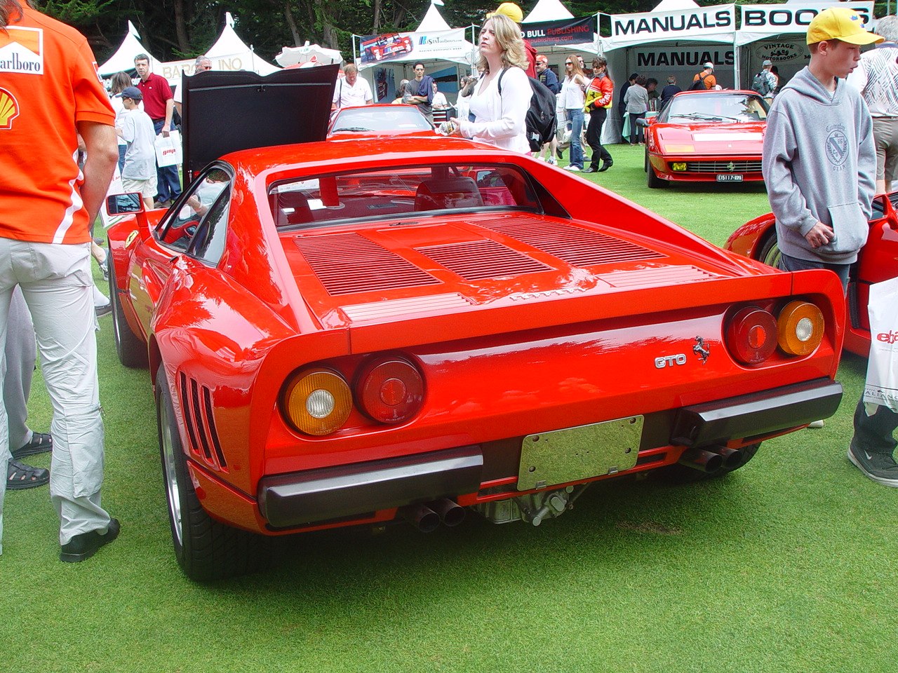 Rear view with round taillights and rear grille vents on red 1980s sports car