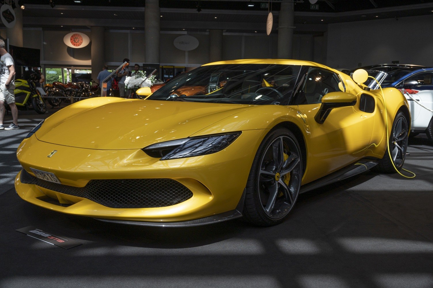 Yellow sports coupe with aerodynamic front and stylish alloy wheels