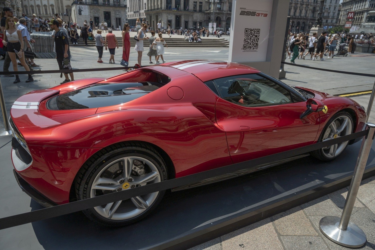 Sleek aerodynamic body and rear engine cover of a red sports coupe