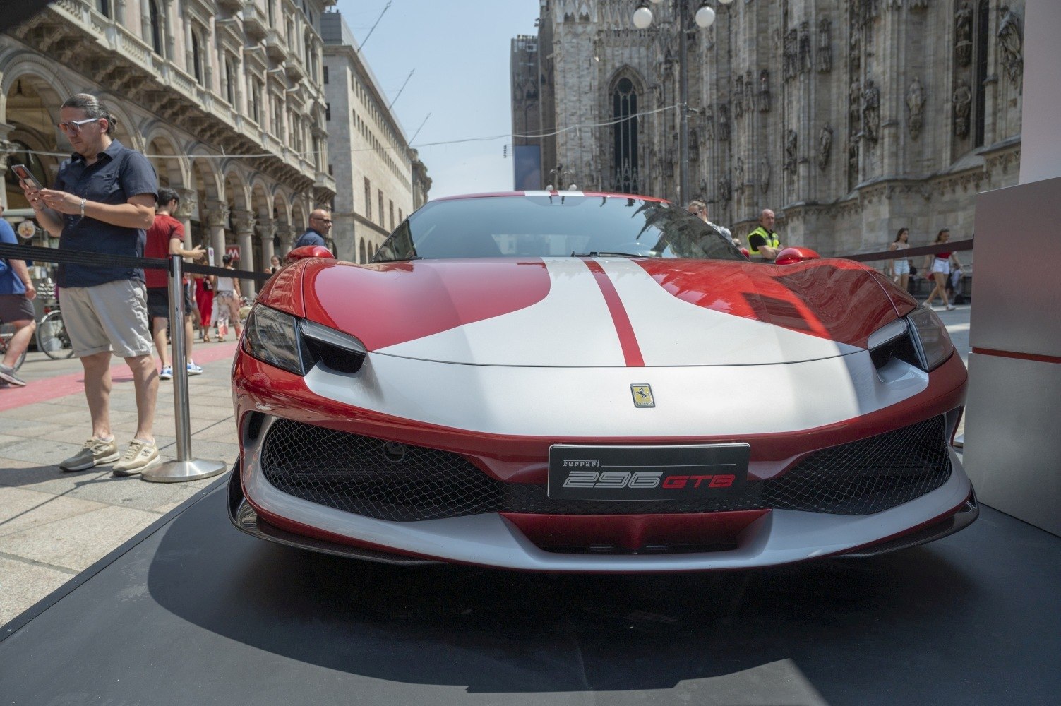 Front view showcasing aggressive headlights and racing stripe.