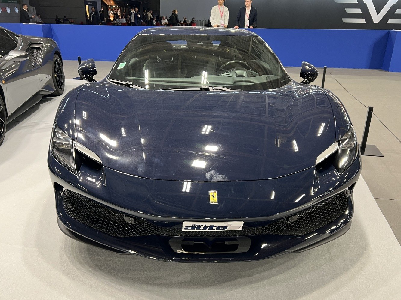 Sleek front fascia with aerodynamic intakes and sharp headlights.
