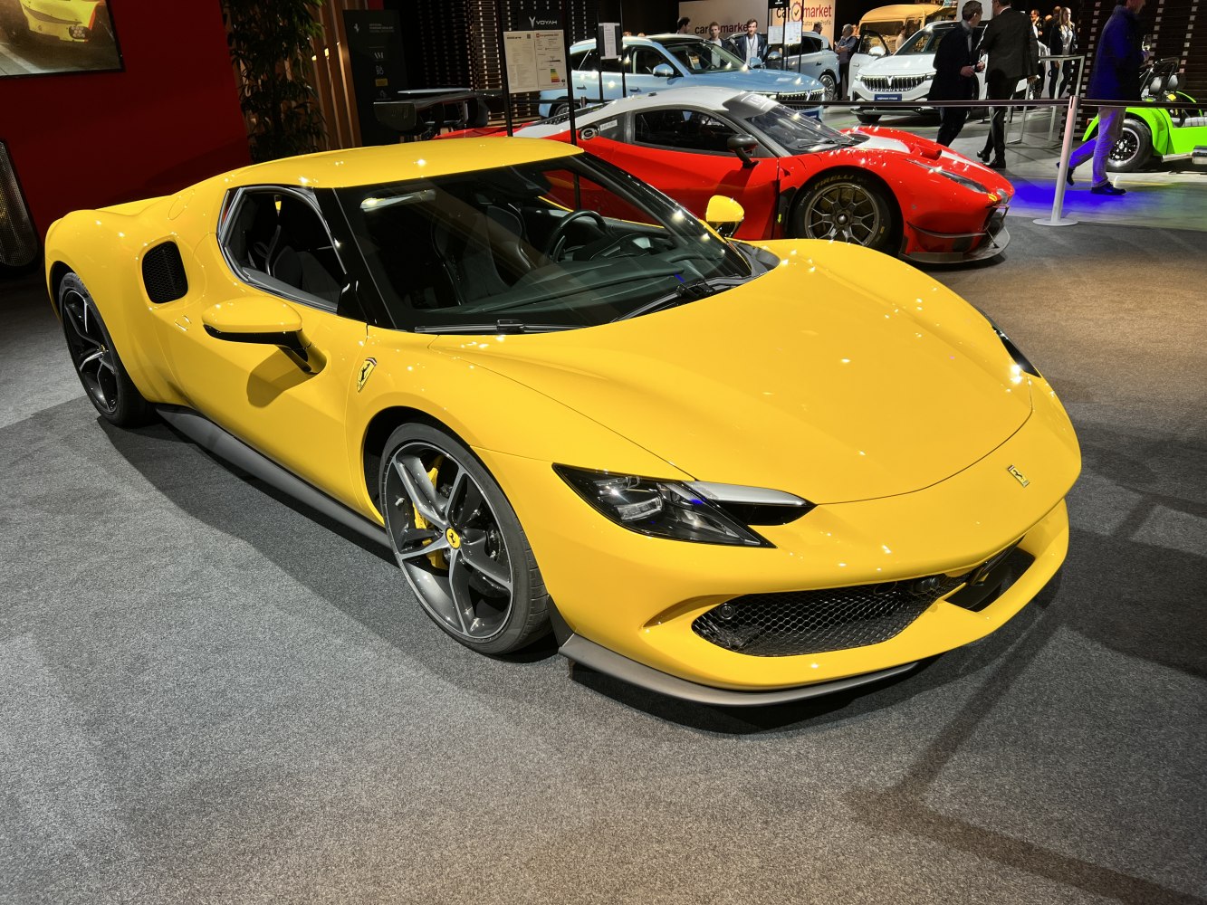Yellow modern sports coupe front with LED headlights and air intake mesh