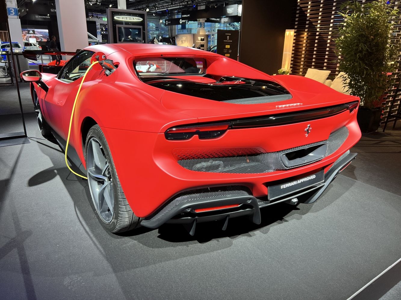 Sleek sports car rear with electric charging port and aerodynamic design