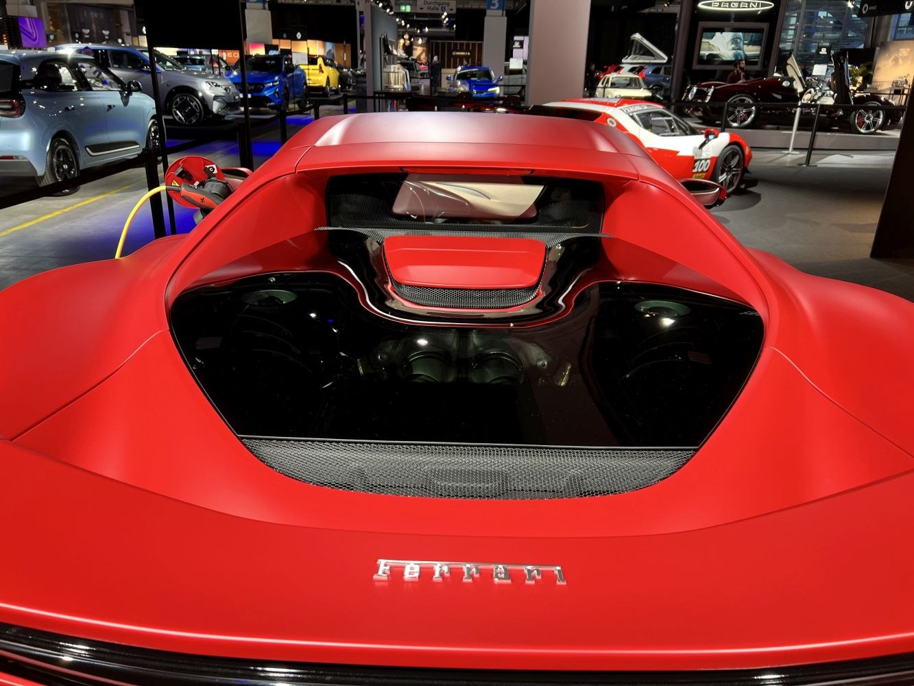 Rear engine bay and charging port of a hybrid supercar.
