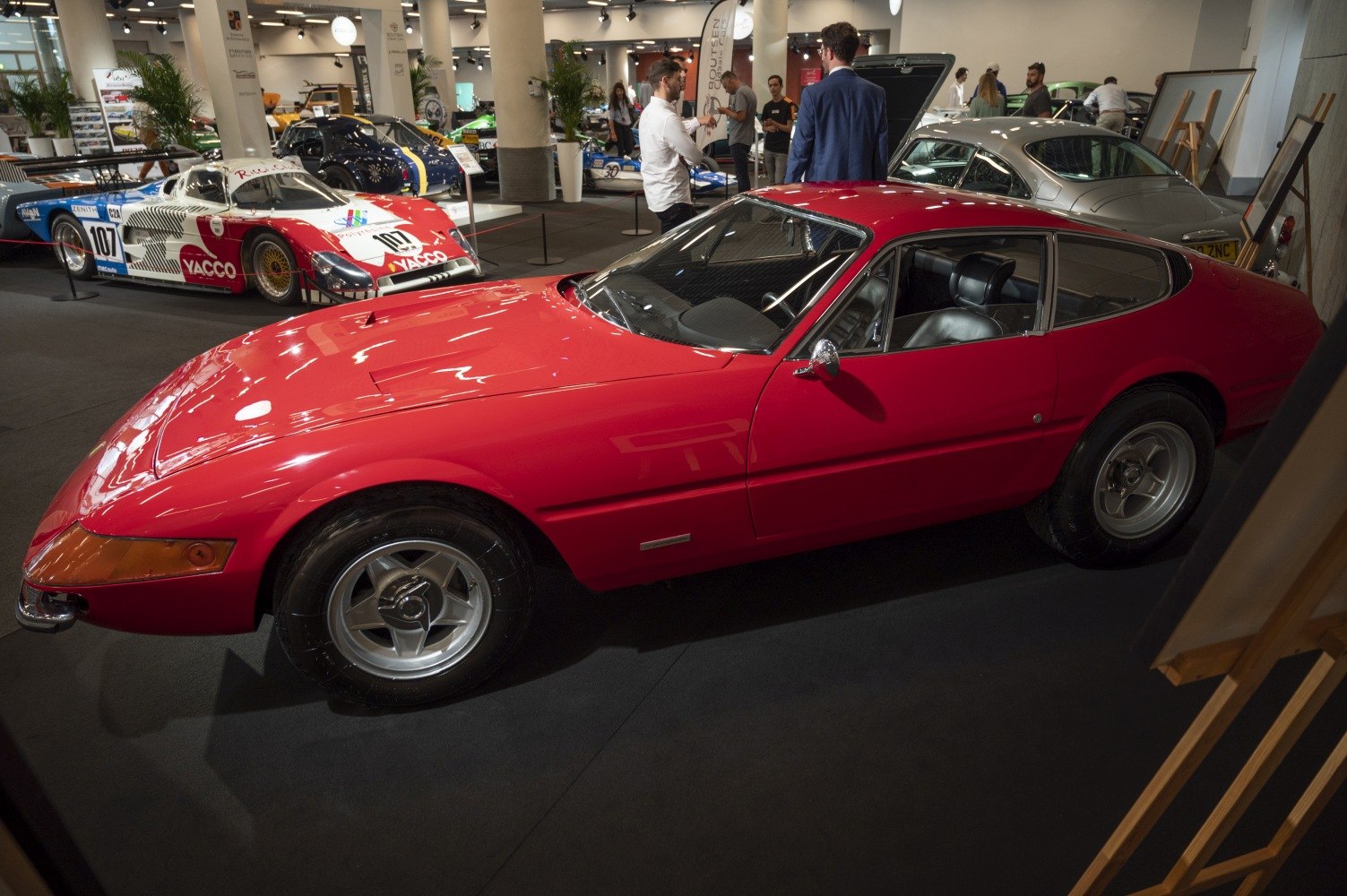 Sleek curved vintage sports car with classic alloy wheels