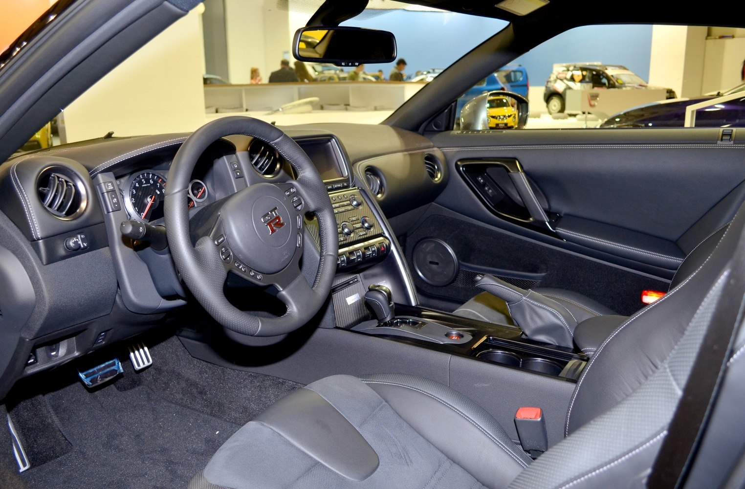 Dashboard and steering wheel with center console and leather seats interior