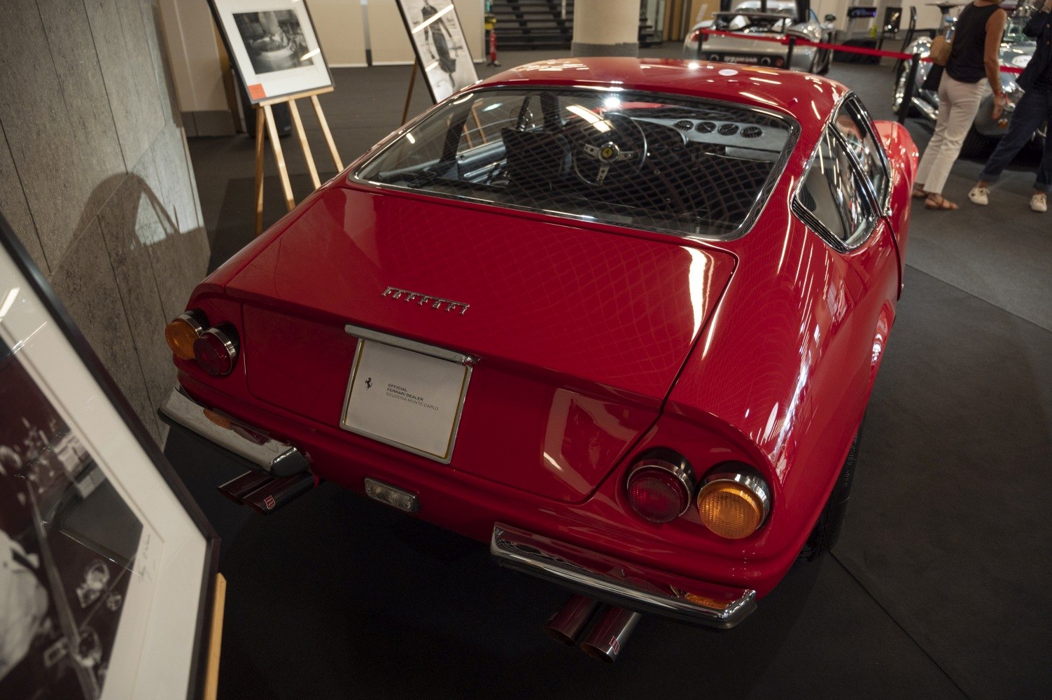 Red vintage sports car rear with interior dashboard visible