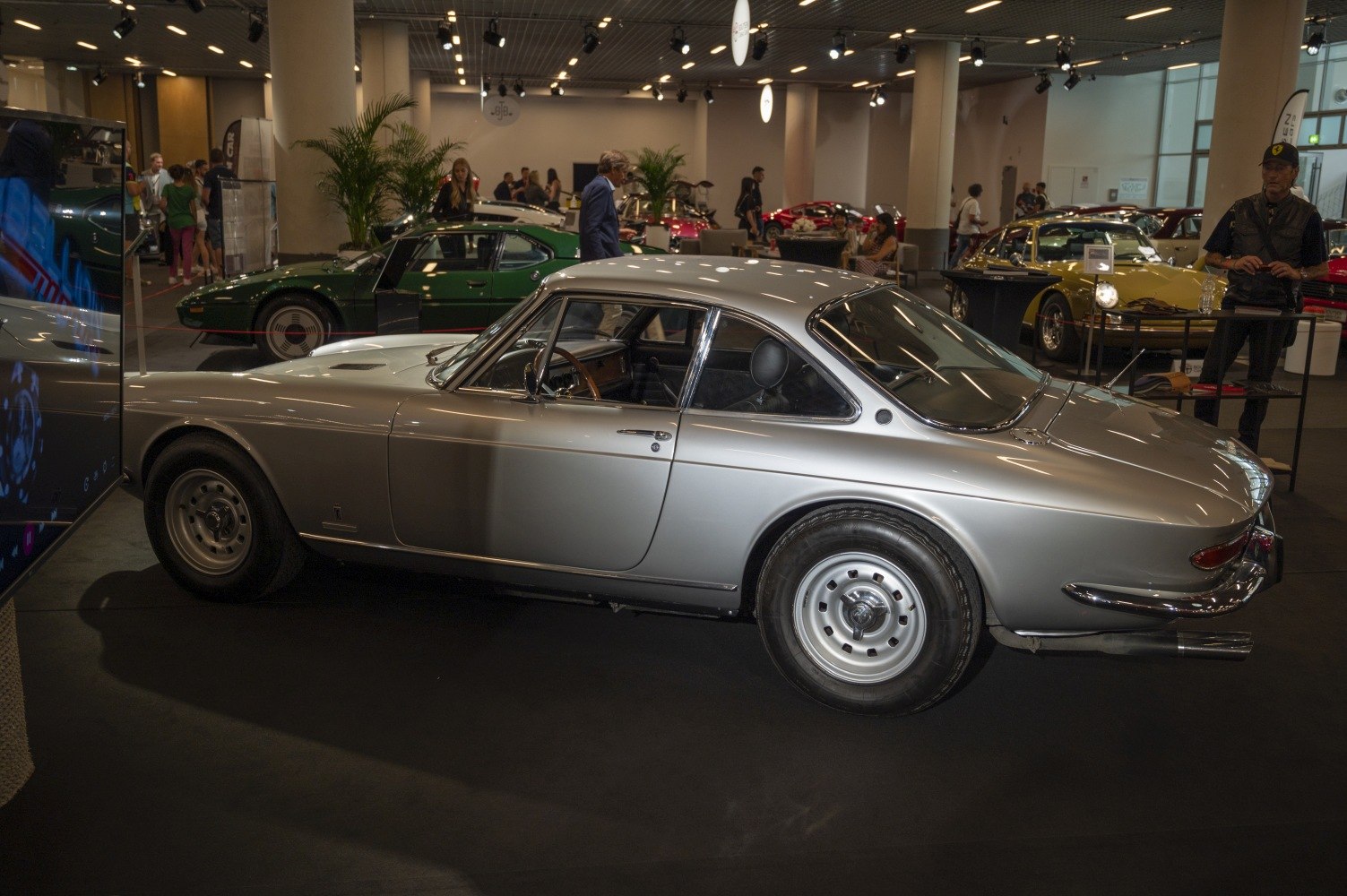 Silver vintage sports coupe with smooth lines and steel wheels
