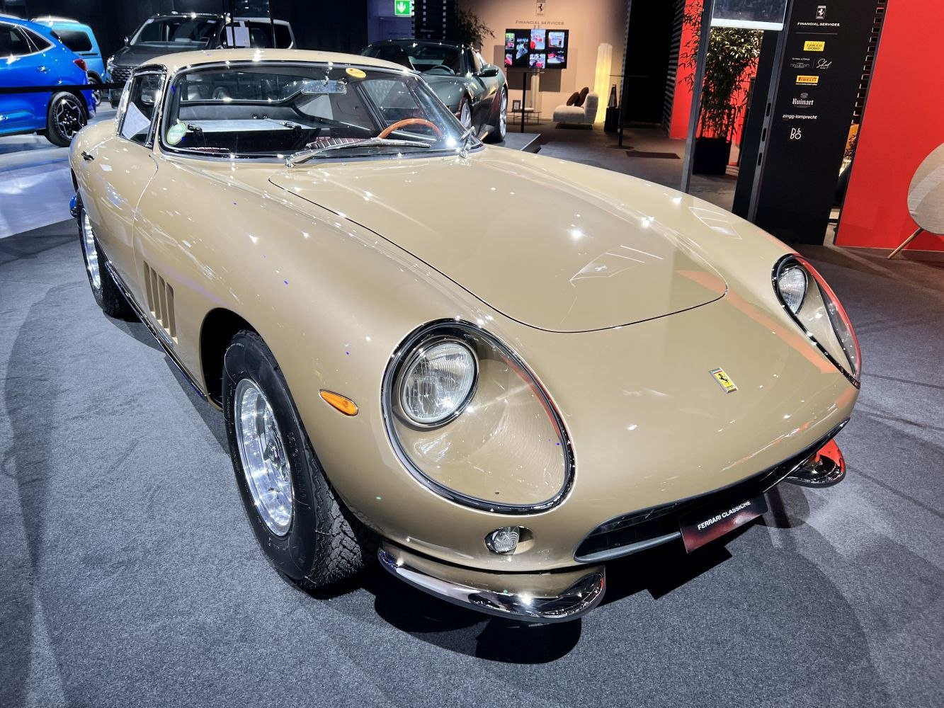 Vintage luxury coupe with round headlights and sleek chrome bumper