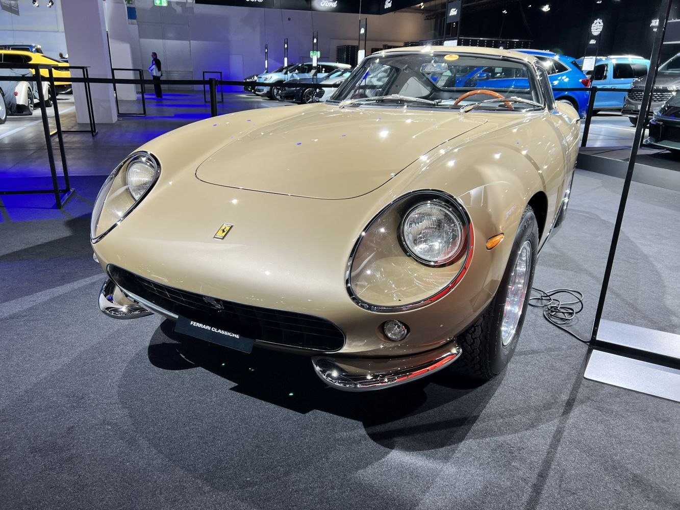 Front view with round headlights and chrome bumper of classic sports coupe
