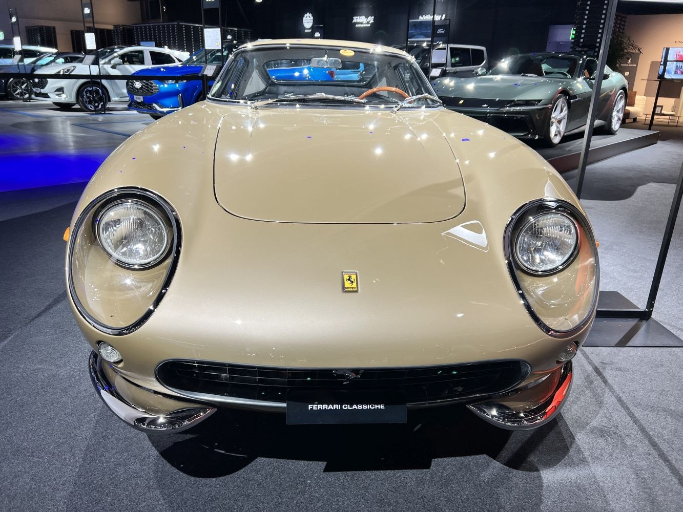 Front view with round headlights and wide horizontal grille