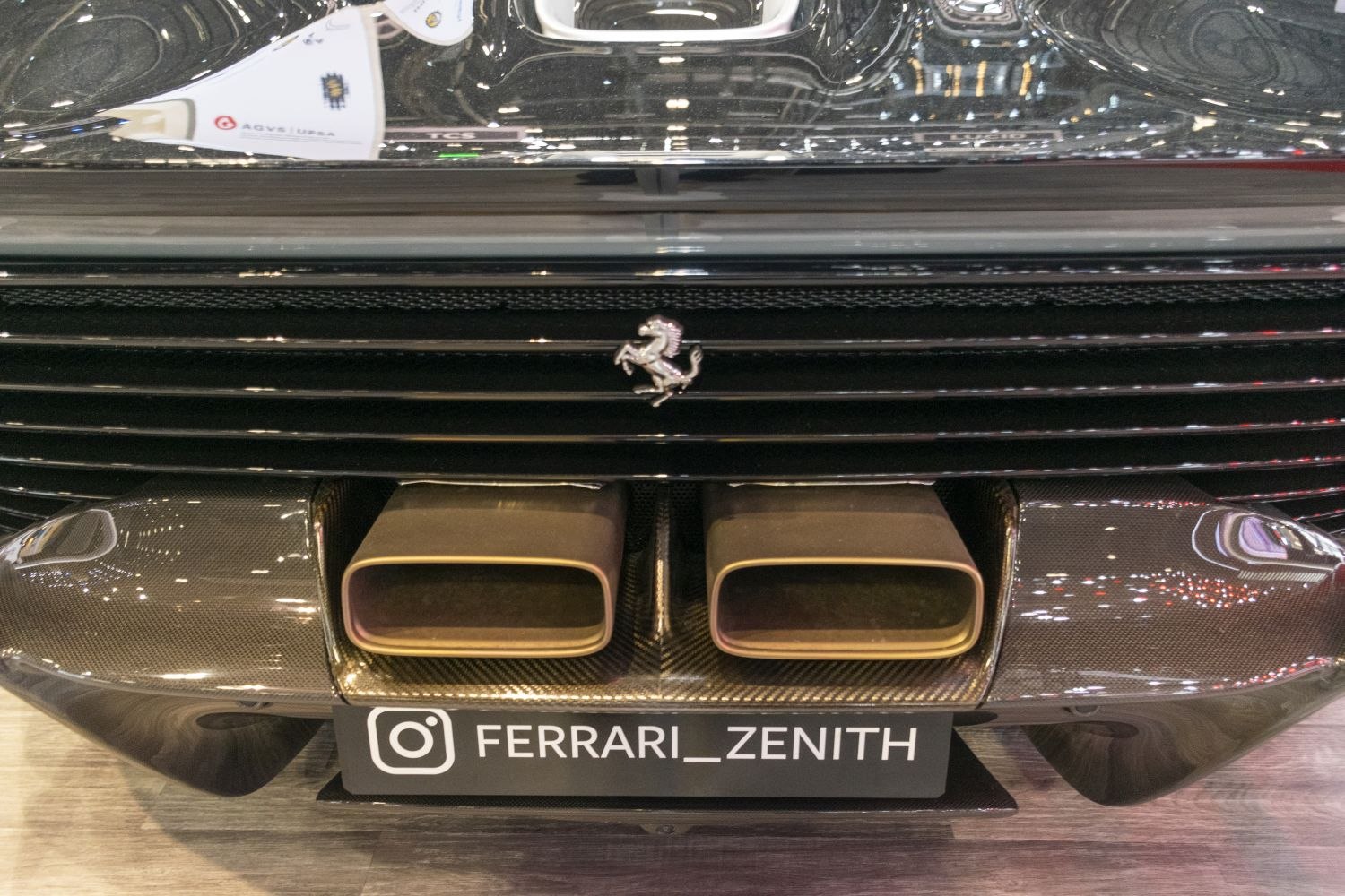 Dual rear exhaust tips with prancing horse emblem