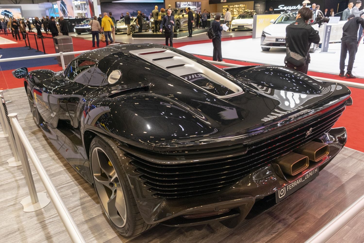 Rear view of sleek aerodynamic body with unique rectangular exhaust pipes.