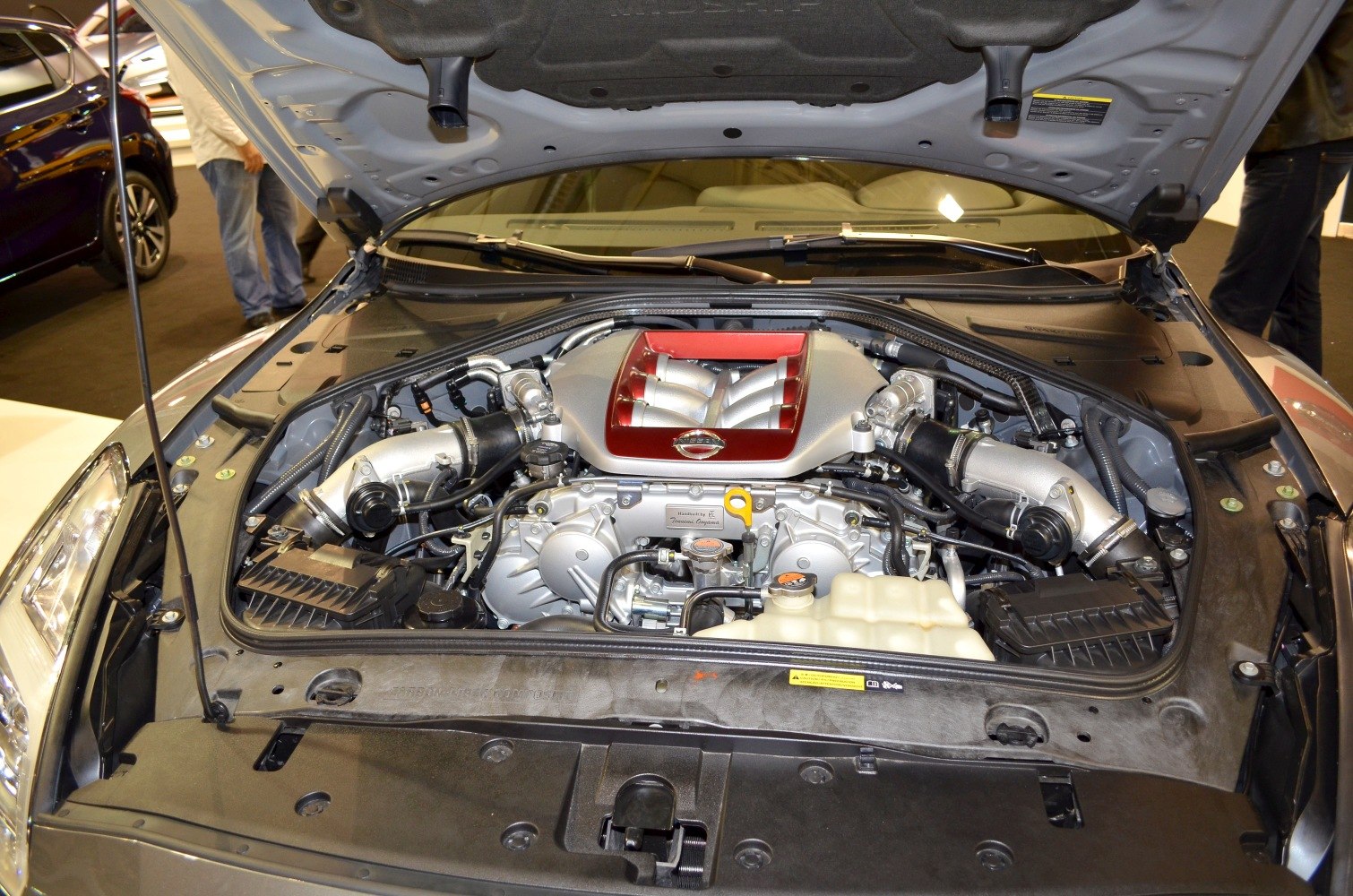 Twin-turbo V6 engine setup under open hood