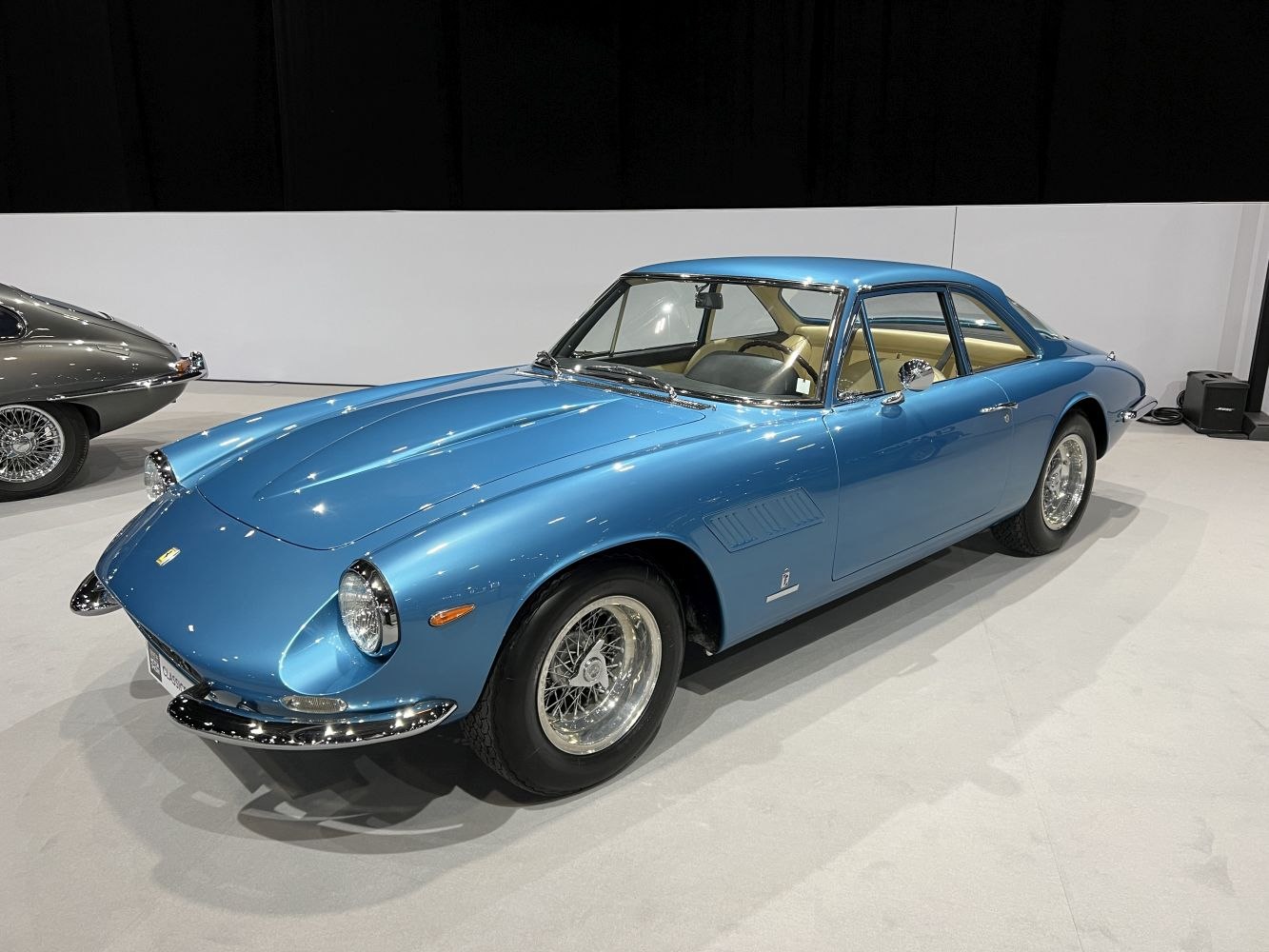 Blue classic coupe with wire-spoke wheels and chrome details