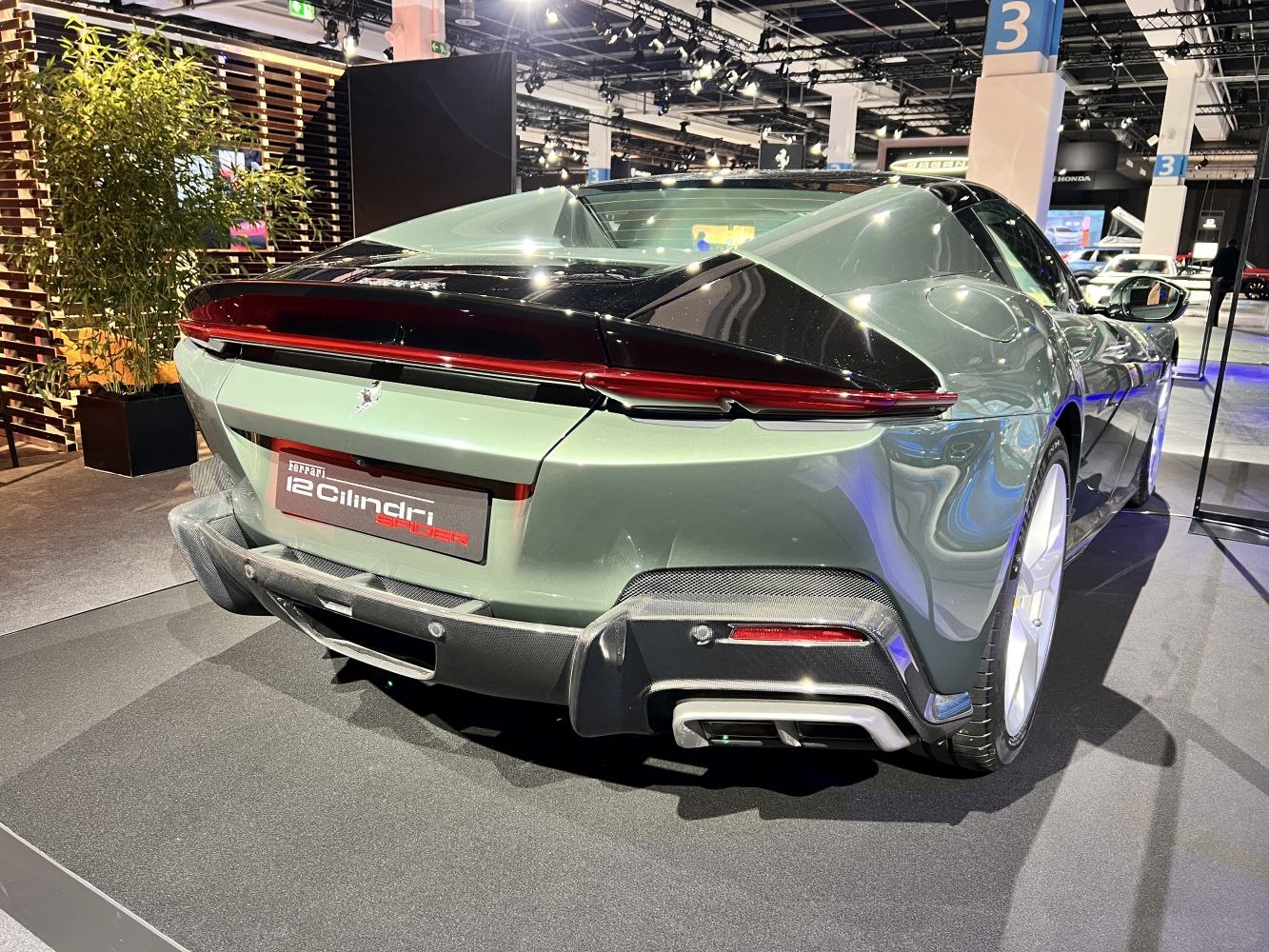 Sleek rear design with prominent tail lights and carbon fiber diffuser.