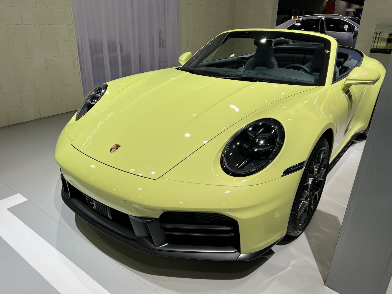 Front view of convertible sports car with round headlights