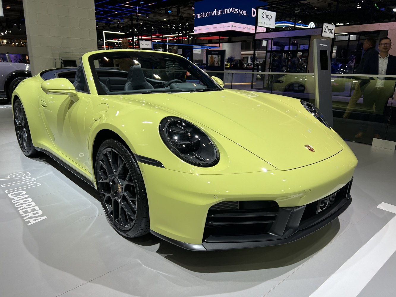 Yellow convertible with distinctive round headlights and black multi-spoke wheels