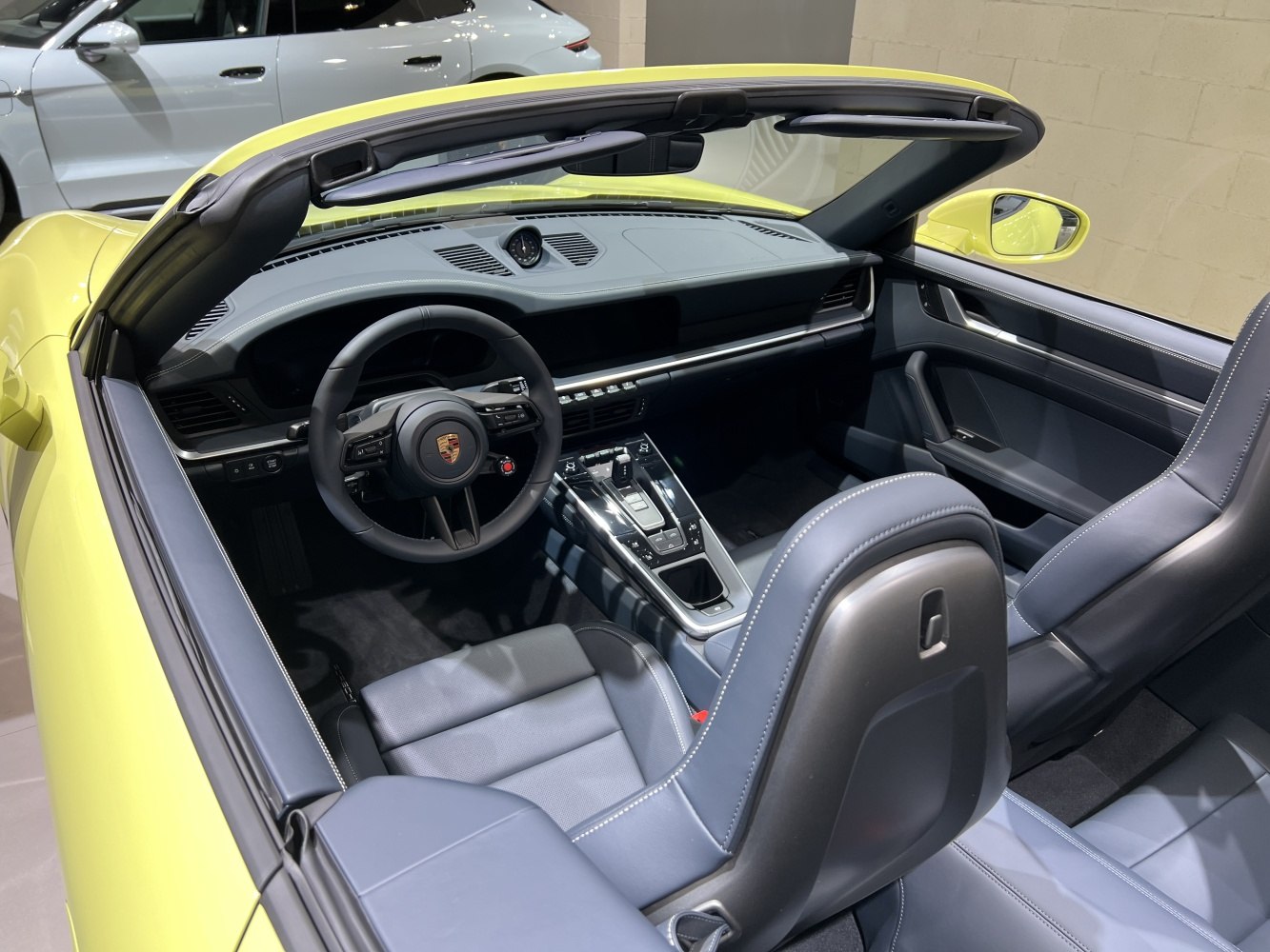 Convertible car interior with sleek dashboard and multifunction steering wheel
