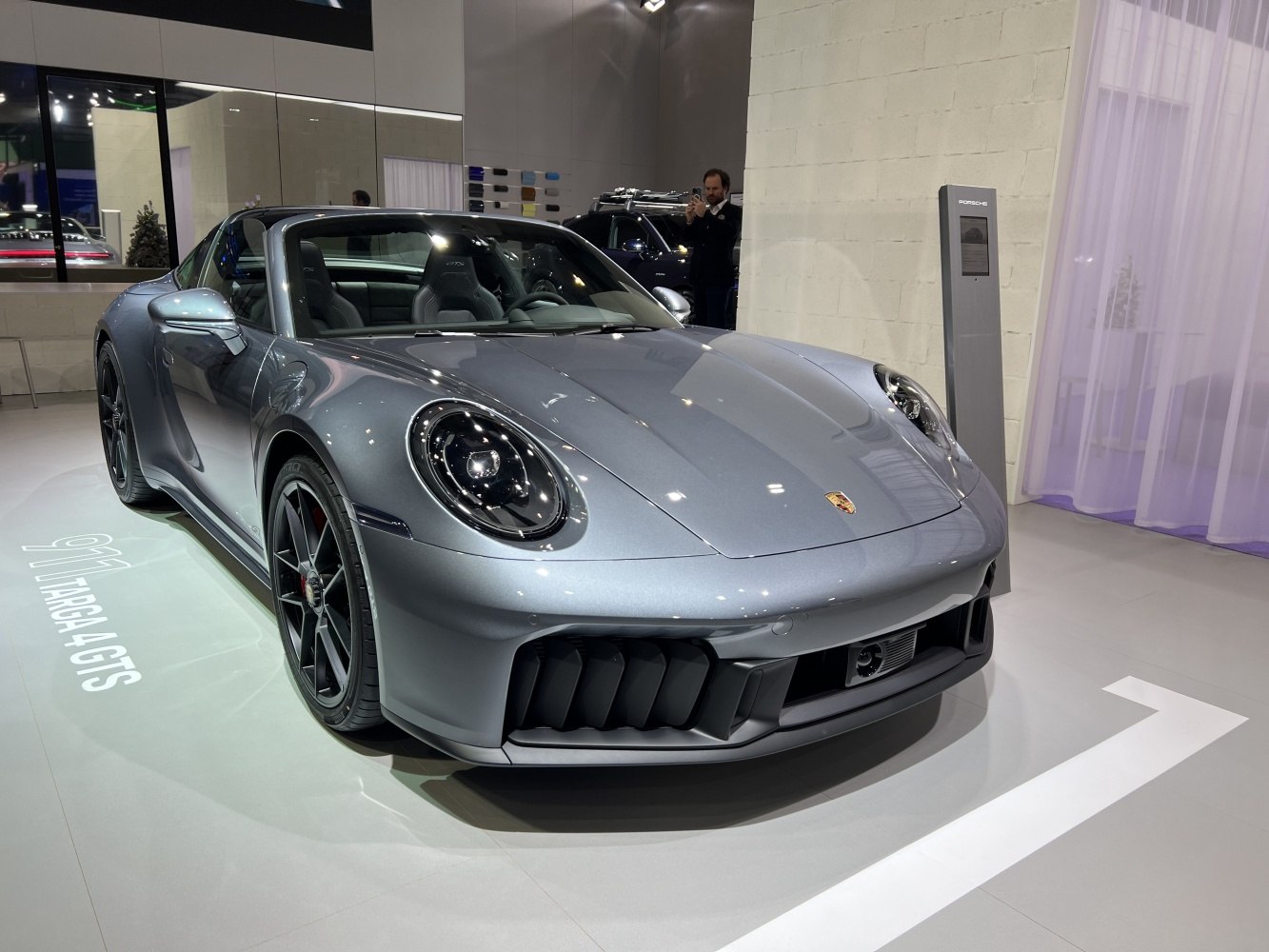 Sleek front view with round headlights and aerodynamic bumpers