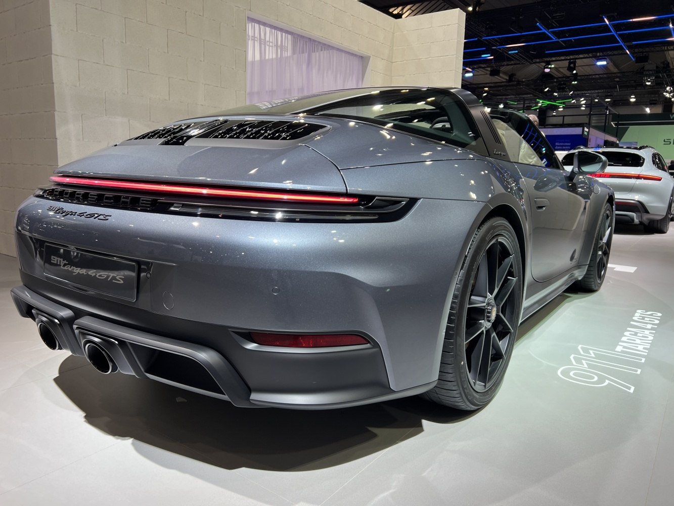 Rear view of sporty coupe with sleek rear lights and dual exhausts
