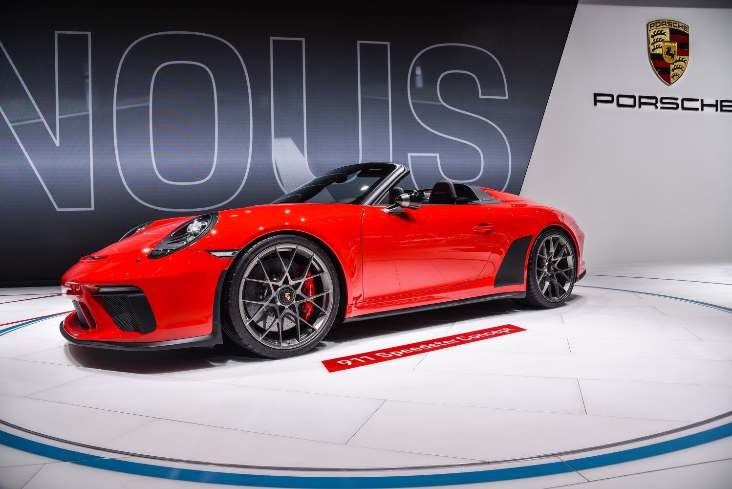Red convertible sports car with aerodynamic design and performance wheels