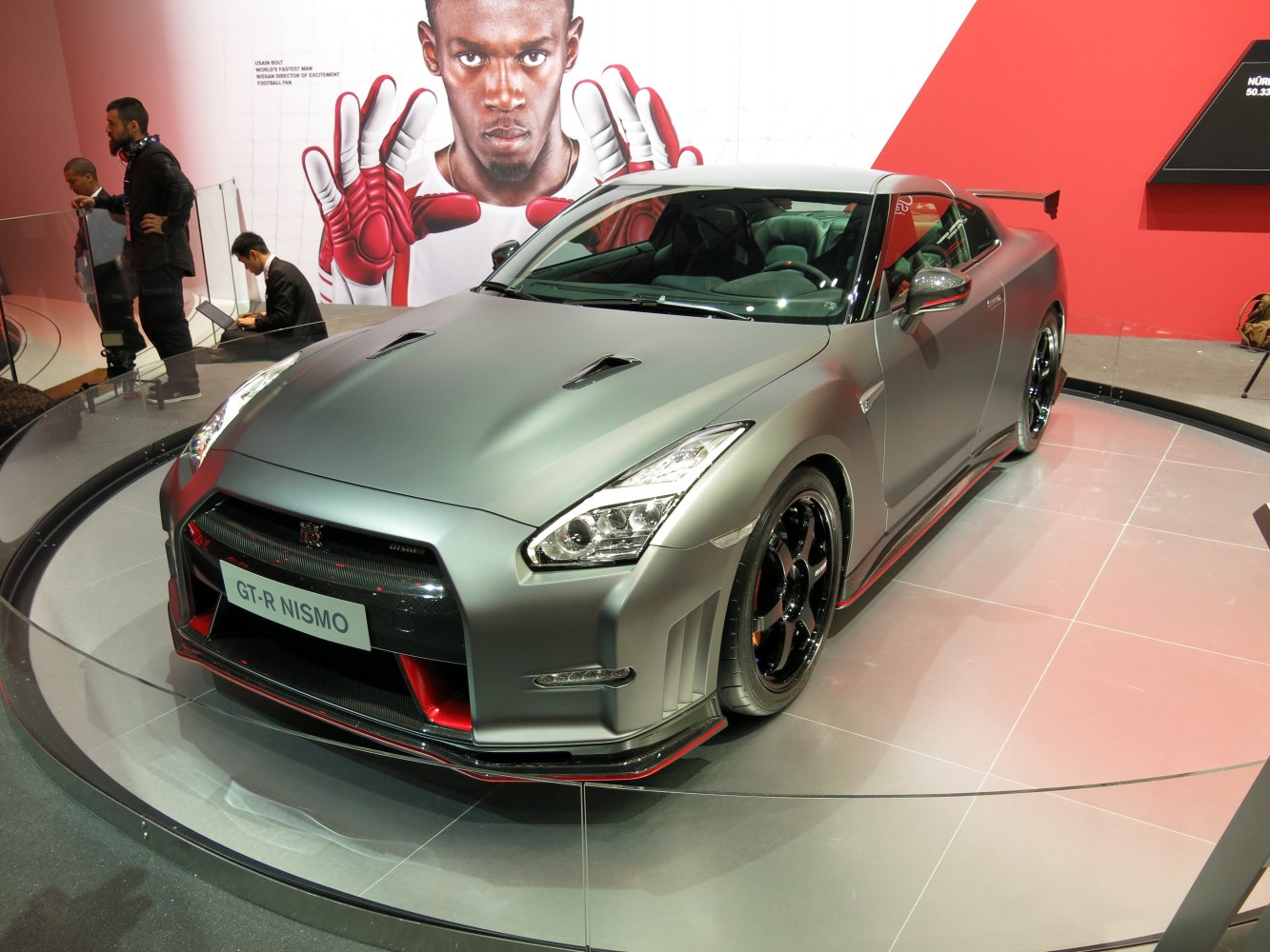Aggressive front design and aerodynamic features with twin hood vents and rear wing