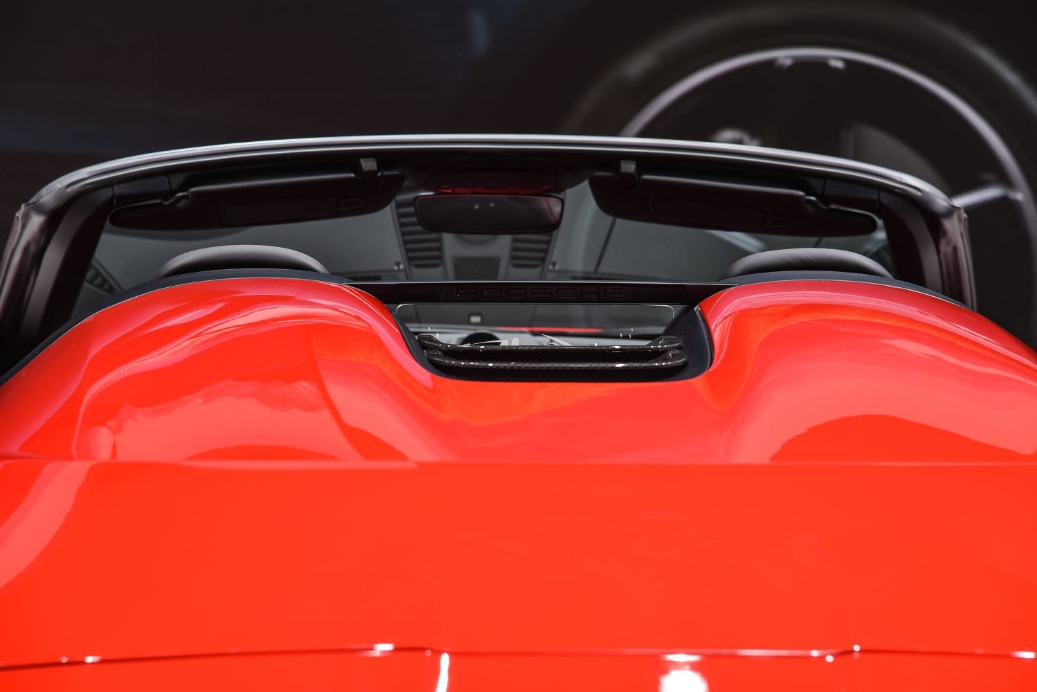 Rear double bubble cover design with wind deflector on a convertible sports car